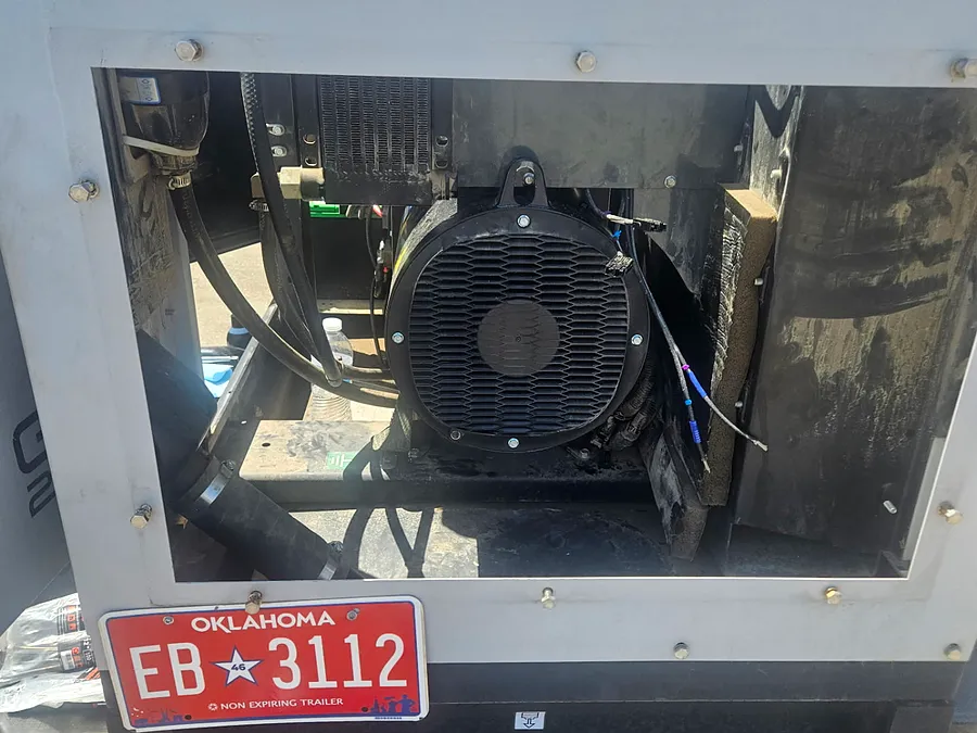 Trailer-mounted generator opened for service