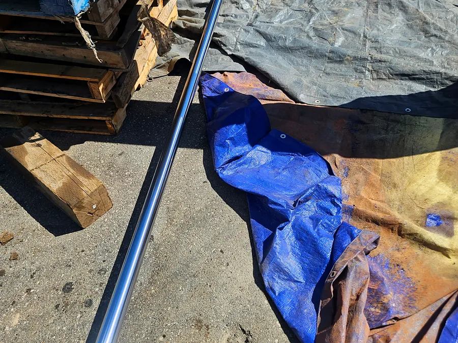 JCB boom hydraulic cylinder rod removed for inspection