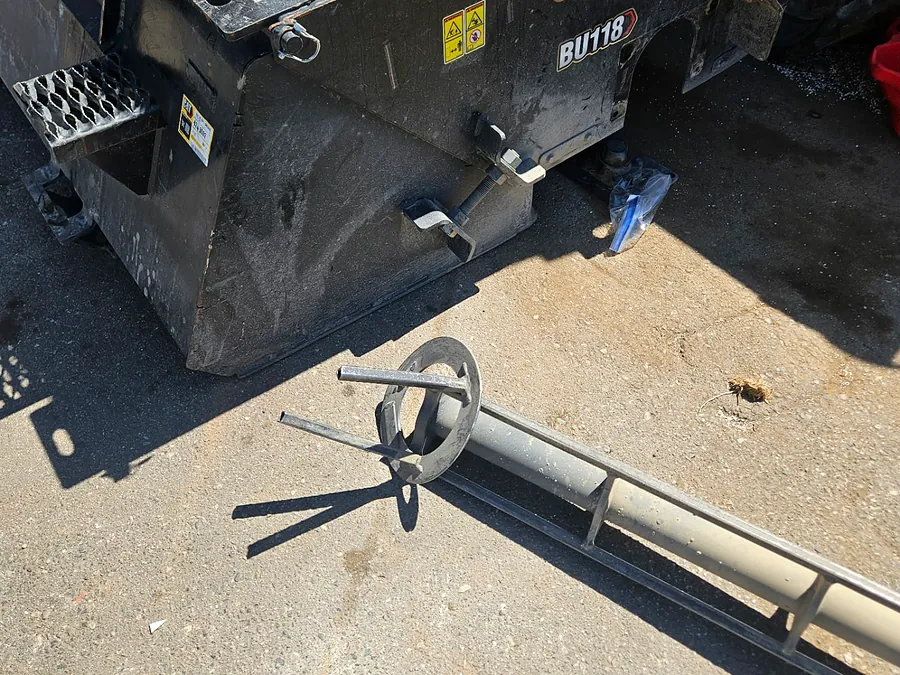 CAT broom attachment auger removed for repair