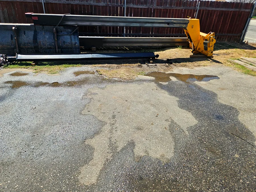 JCB telehandler boom removed and staged for repair