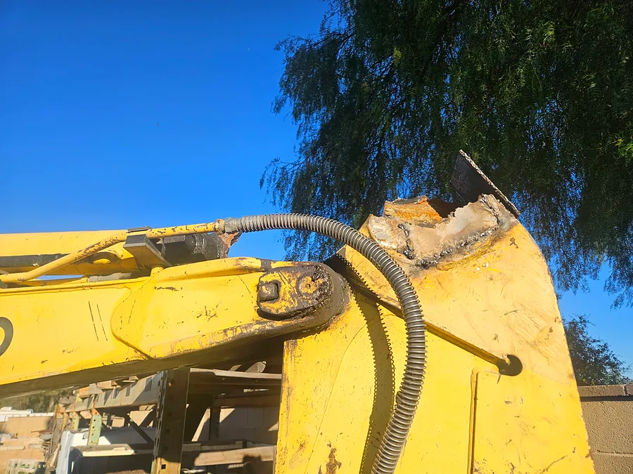 Repaired and welded section of a heavy equipment boom