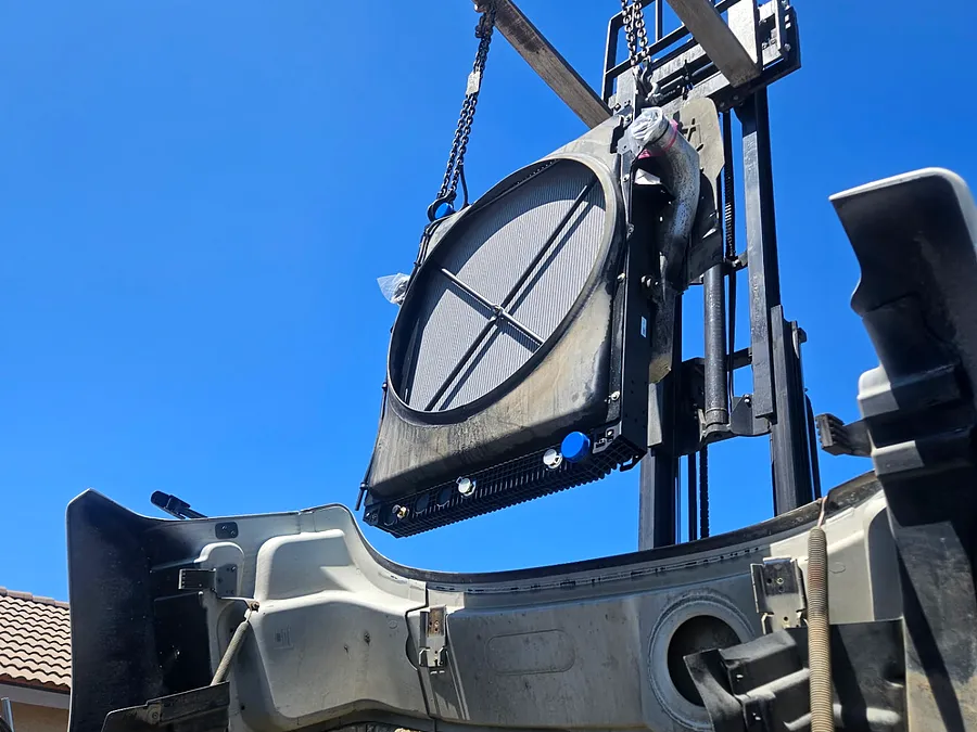 Radiator assembly lifted out for replacement