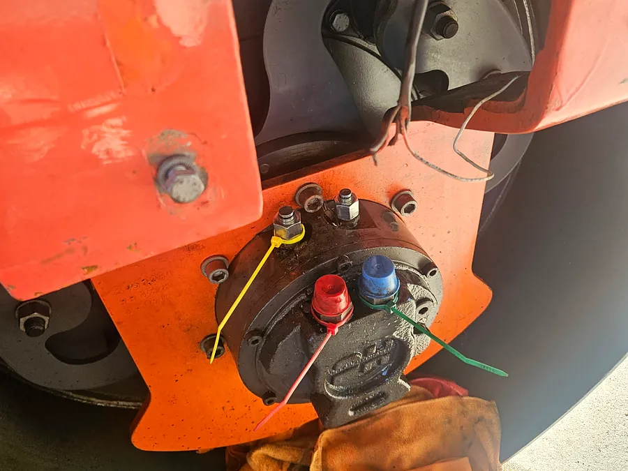 Hydraulic drive motor removed for repair on a lift